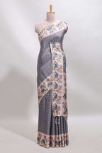 Grey checked tussar saree with contrast ikkat style elephant and floral print border and printed pallu
