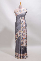 Grey checked tussar saree with contrast ikkat style elephant and floral print border and printed pallu