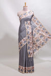 Grey checked tussar saree with contrast ikkat style elephant and floral print border and printed pallu