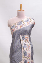 Grey checked tussar saree with contrast ikkat style elephant and floral print border and printed pallu