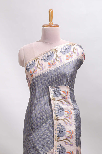 Grey checked tussar saree with contrast ikkat style elephant and floral print border and printed pallu