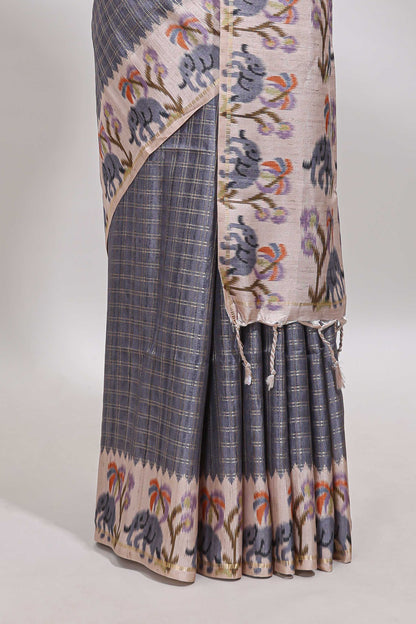 Grey checked tussar saree with contrast ikkat style elephant and floral print border and printed pallu