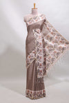 Beaver brown checked tussar saree with contrast ikkat style elephant and floral print border and printed pallu