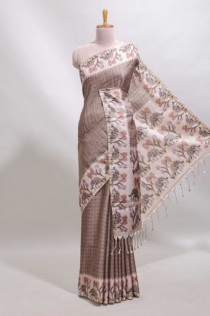 Beaver brown checked tussar saree with contrast ikkat style elephant and floral print border and printed pallu