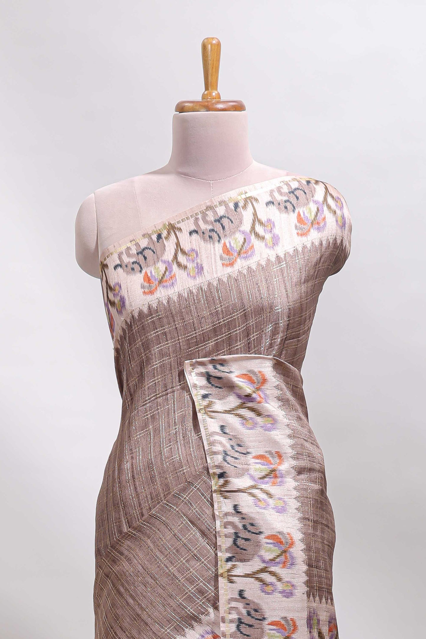 Beaver brown checked tussar saree with contrast ikkat style elephant and floral print border and printed pallu