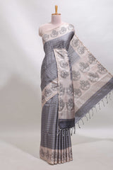 Grey checked tussar saree with contrast traditional elephant border and matching blouse