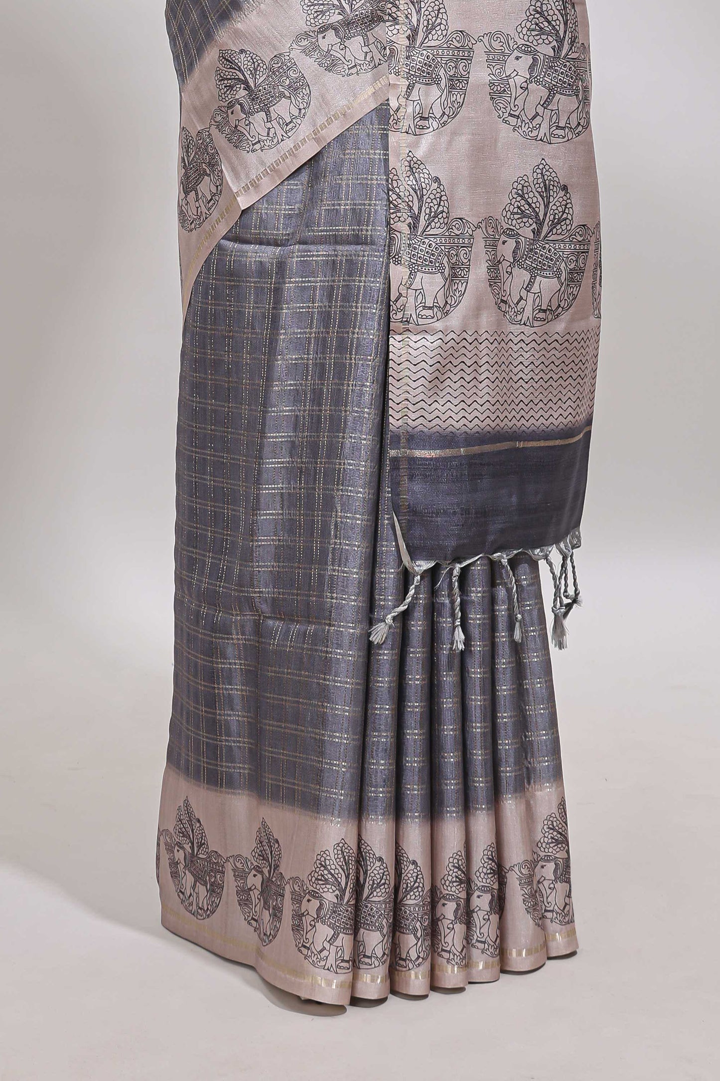 Grey checked tussar saree with contrast traditional elephant border and matching blouse