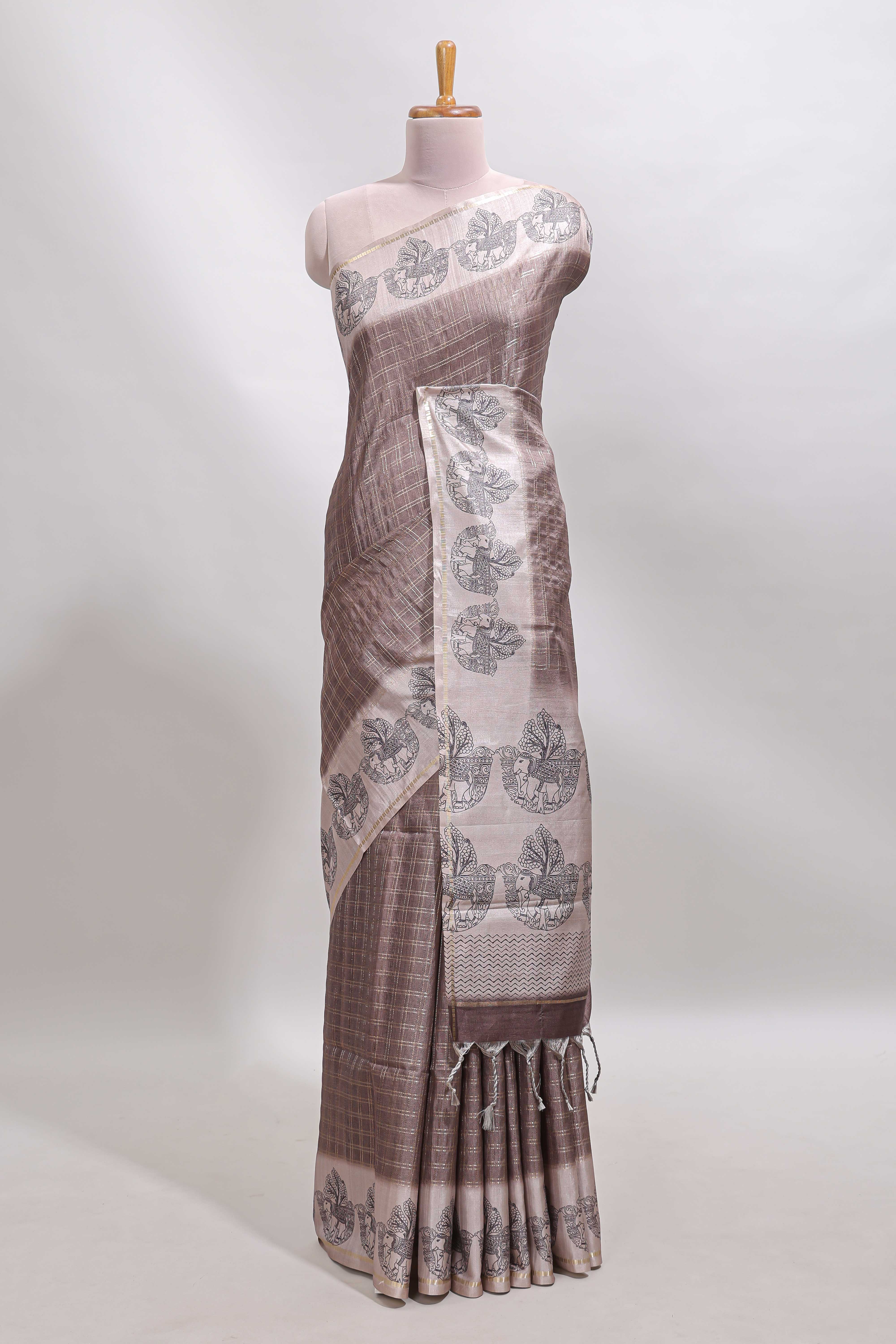 Brown checked tussar saree with contrast traditional elephant border and matching blouse