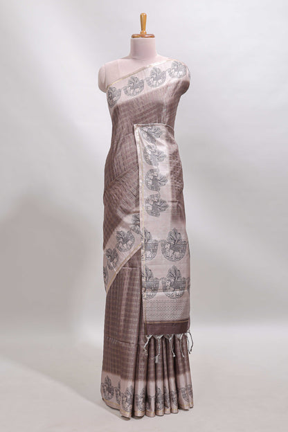 Brown checked tussar saree with contrast traditional elephant border and matching blouse