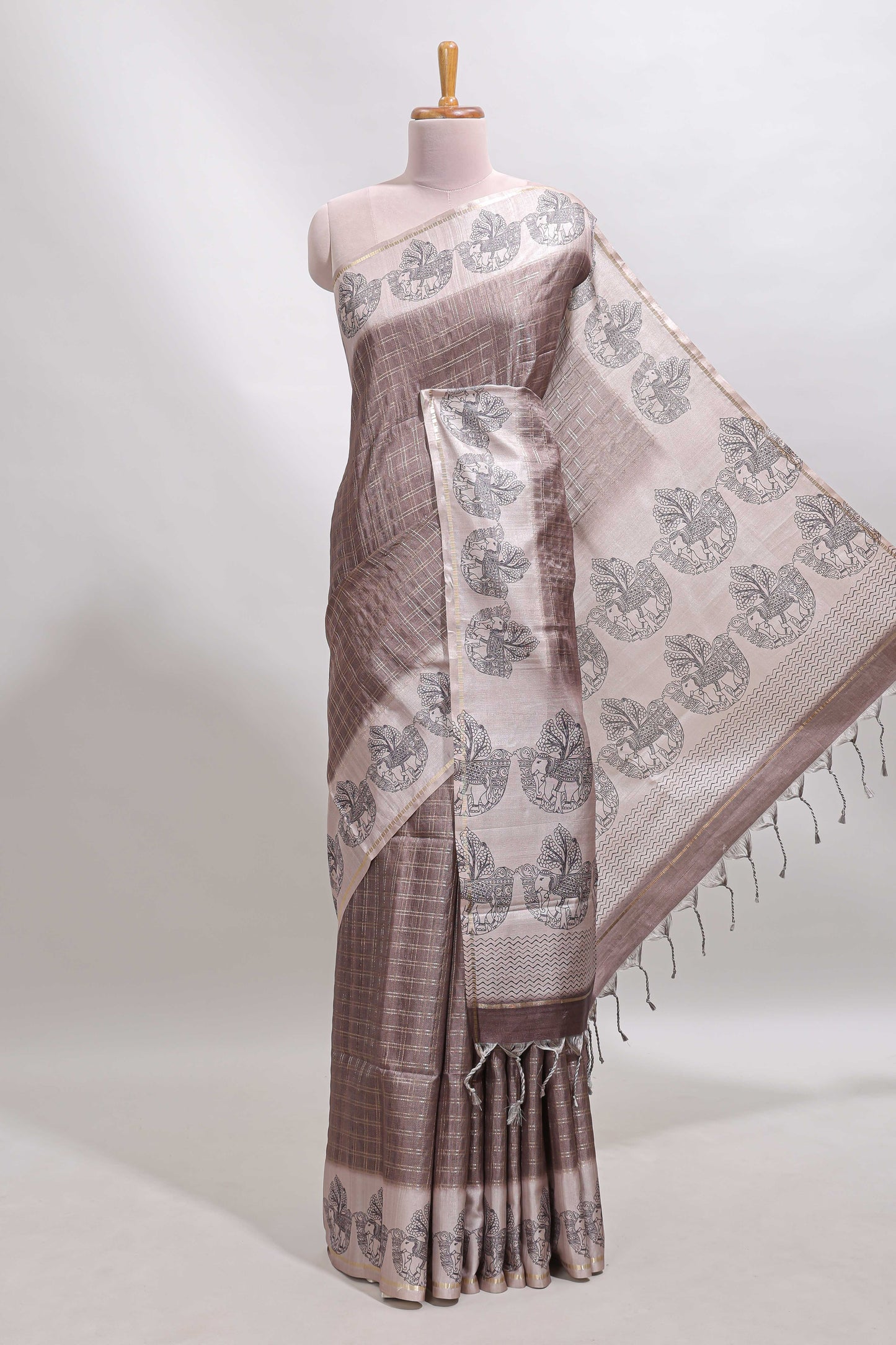 Brown checked tussar saree with contrast traditional elephant border and matching blouse