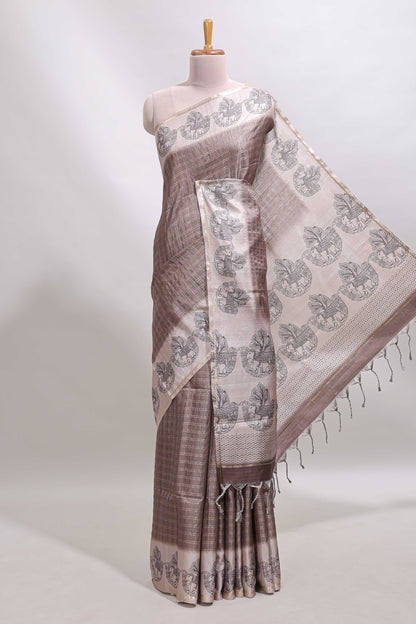 Brown checked tussar saree with contrast traditional elephant border and matching blouse