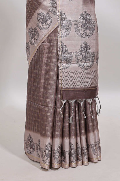 Brown checked tussar saree with contrast traditional elephant border and matching blouse