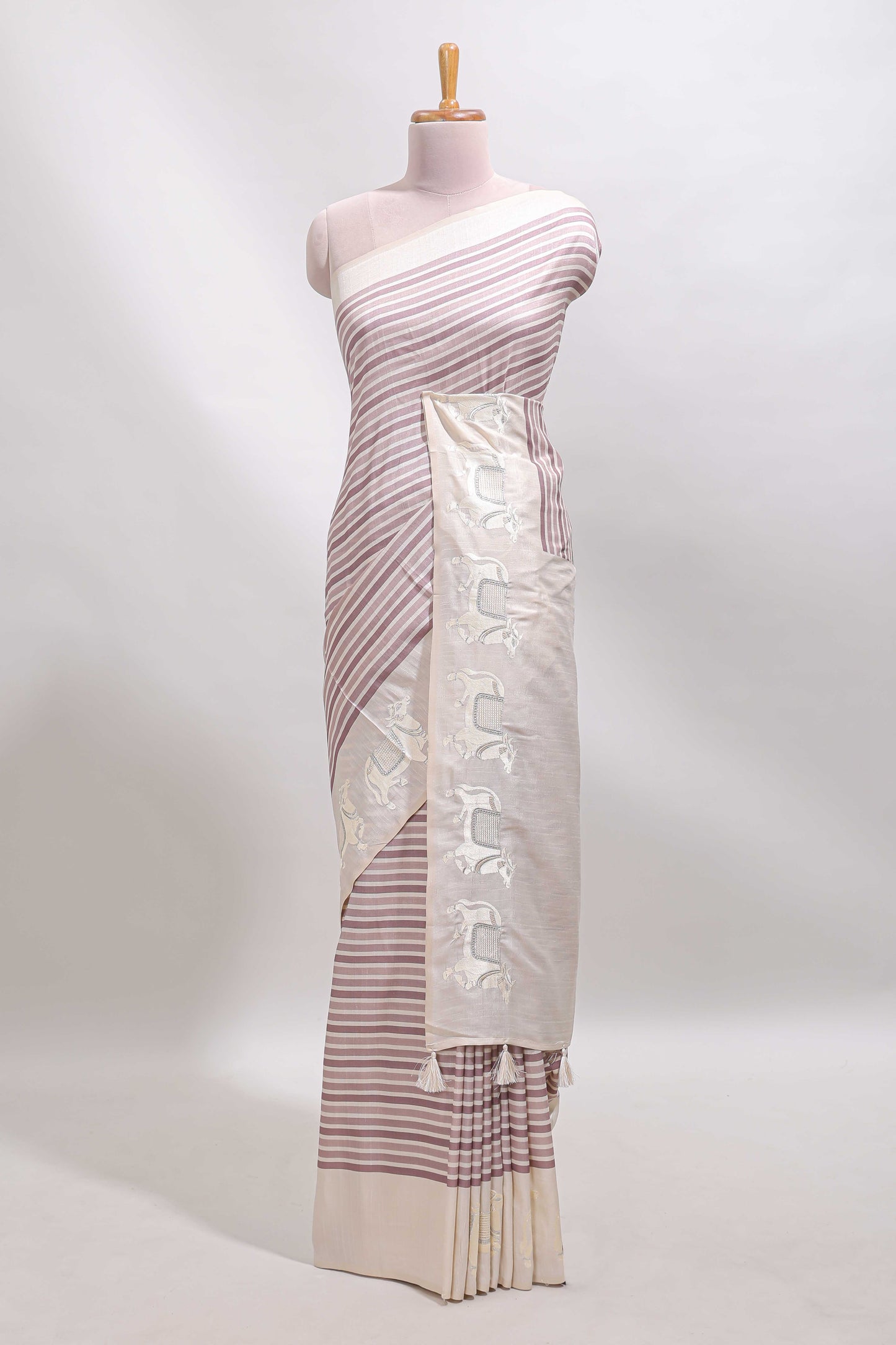 Cream striped tussar saree with contrast border and matching printed blouse