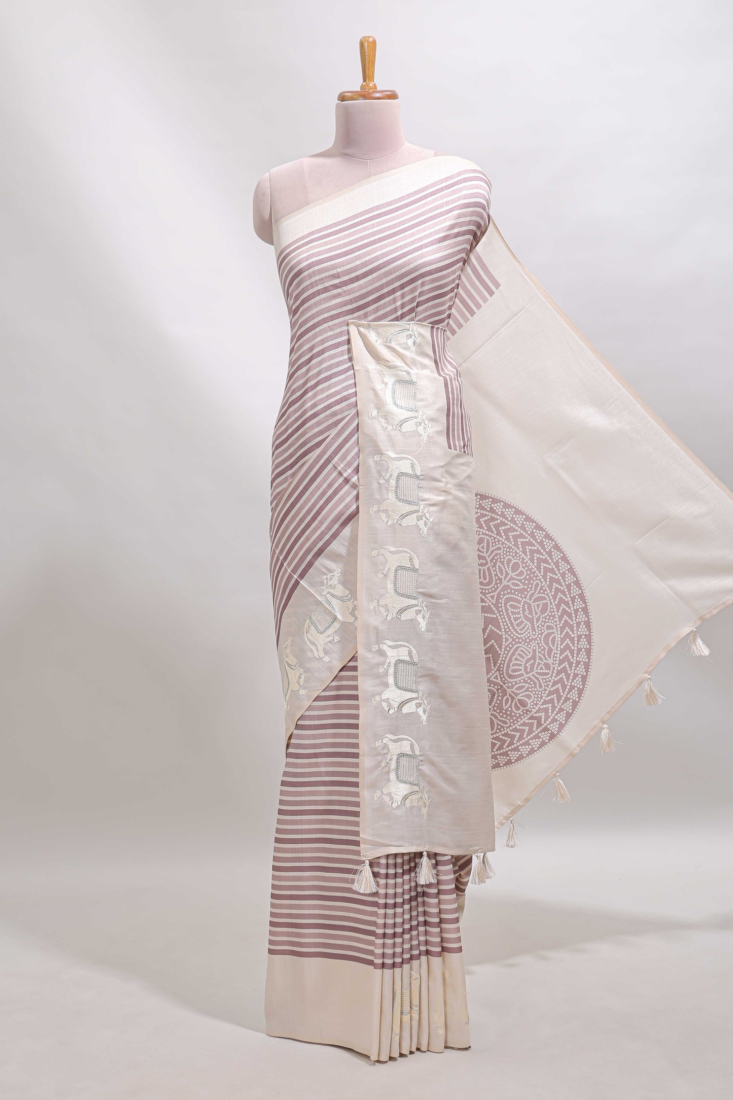 Cream striped tussar saree with contrast border and matching printed blouse