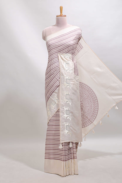 Cream striped tussar saree with contrast border and matching printed blouse