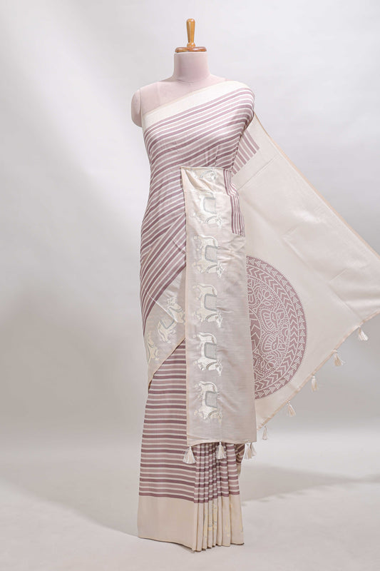 Cream striped tussar saree with contrast border and matching printed blouse