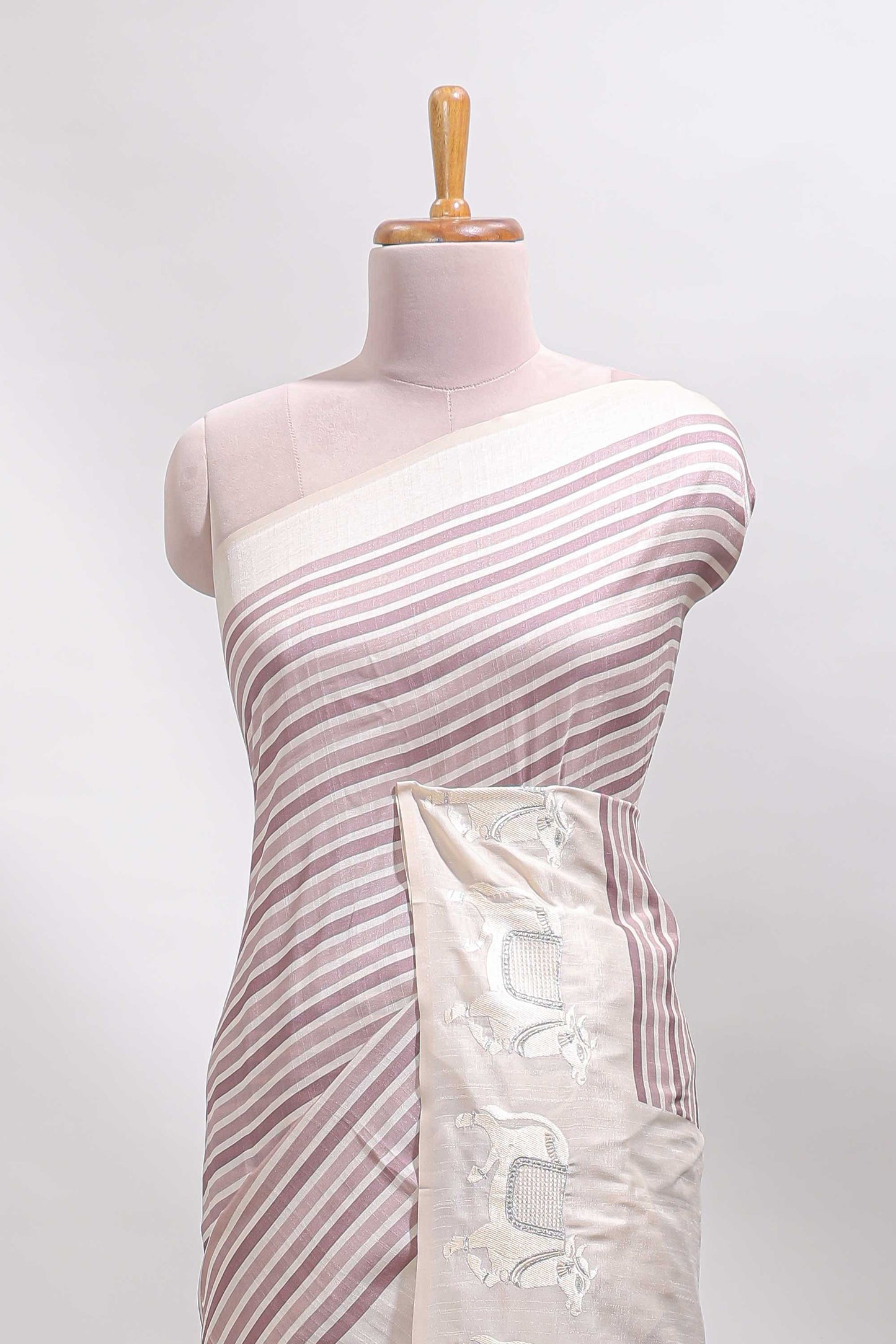 Cream striped tussar saree with contrast border and matching printed blouse