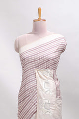 Cream striped tussar saree with contrast border and matching printed blouse