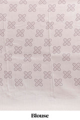 Cream striped tussar saree with contrast border and matching printed blouse