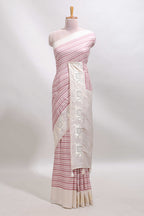 Cream striped tussar saree with contrast border and matching printed blouse
