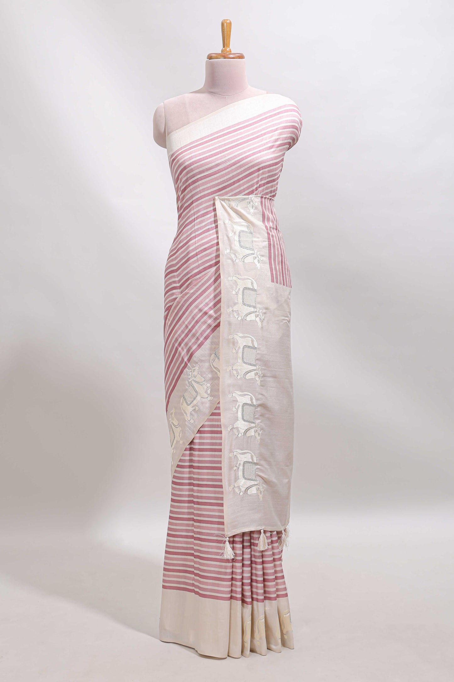 Cream striped tussar saree with contrast border and matching printed blouse