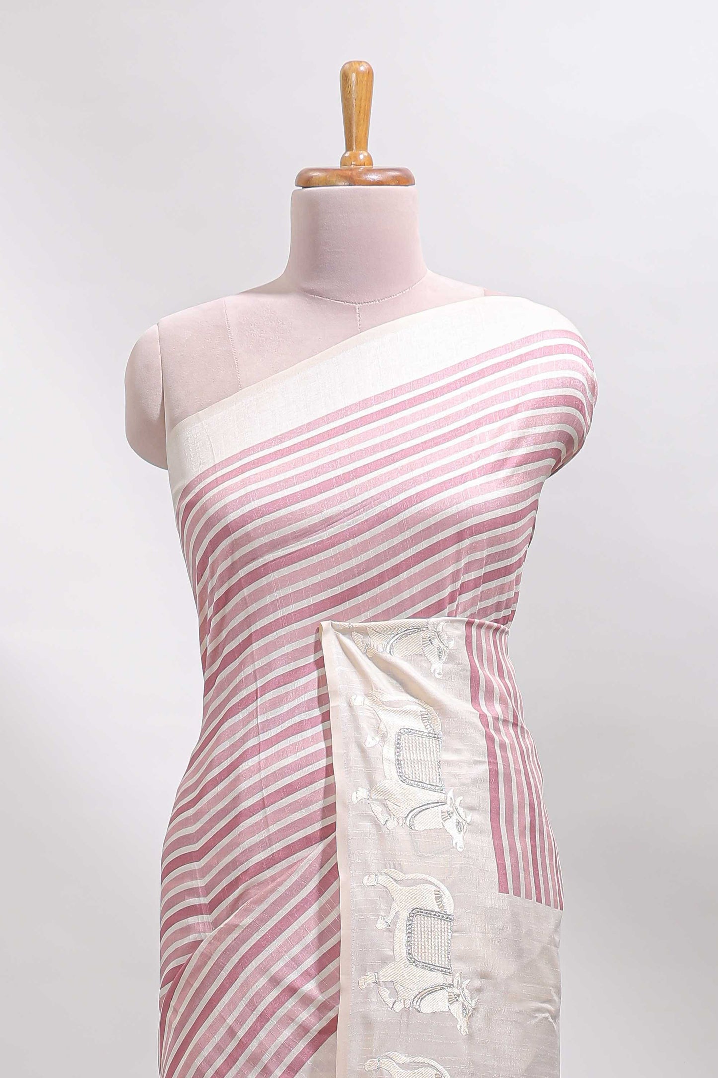 Cream striped tussar saree with contrast border and matching printed blouse