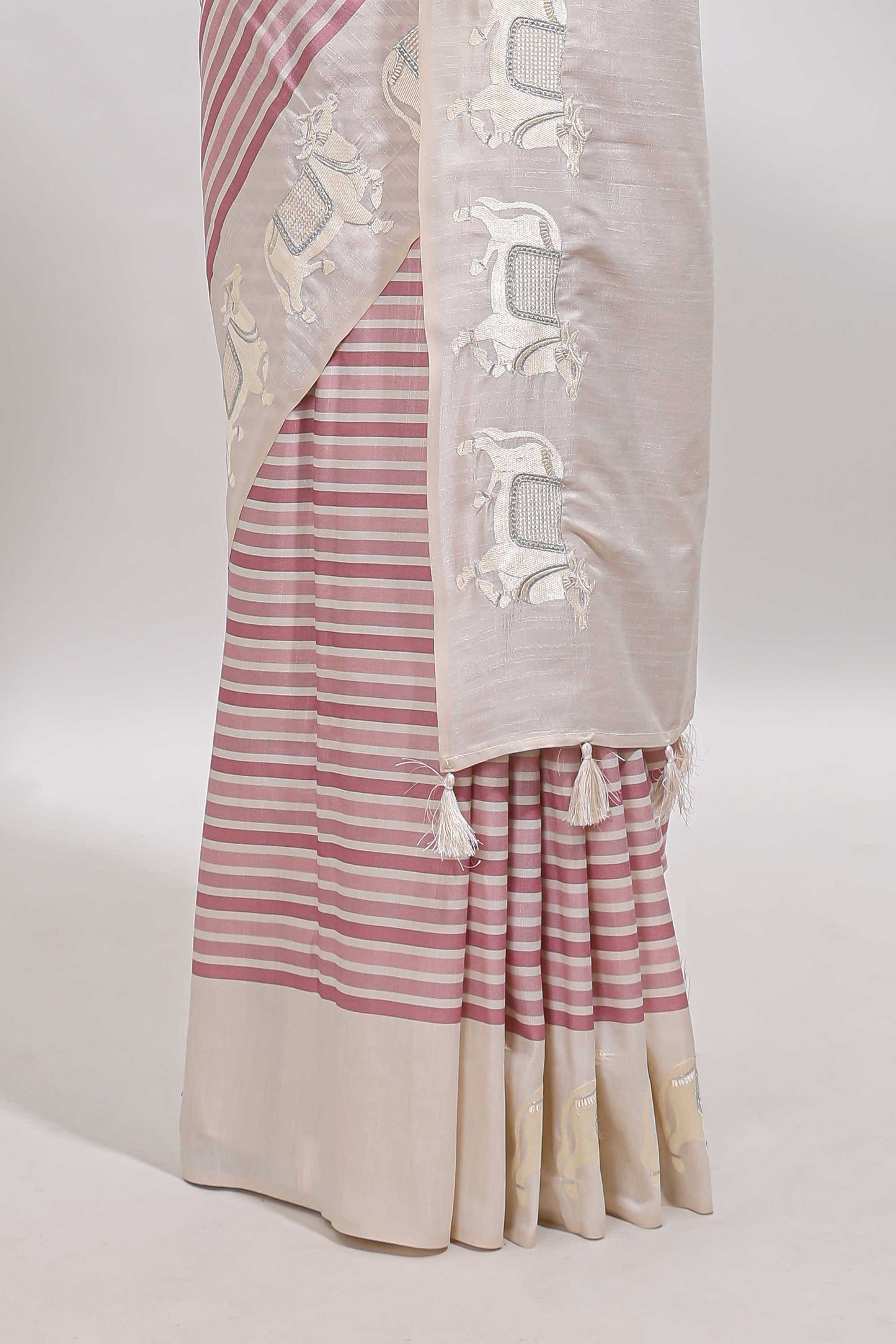 Cream striped tussar saree with contrast border and matching printed blouse