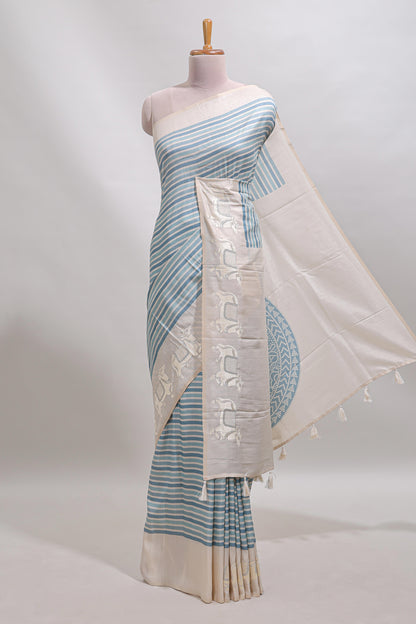 Cream striped tussar saree with contrast border and matching printed blouse