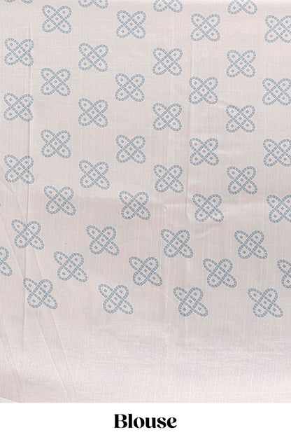Cream striped tussar saree with contrast border and matching printed blouse
