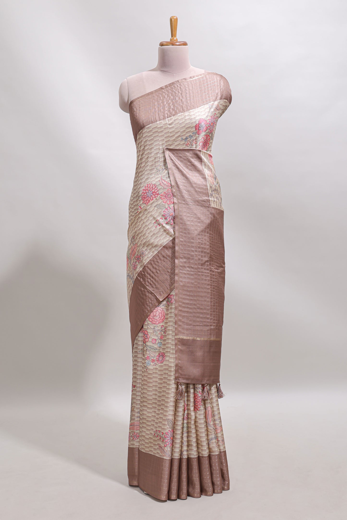 Beige geometric floral design tussar saree with contrast border and floral print blouse