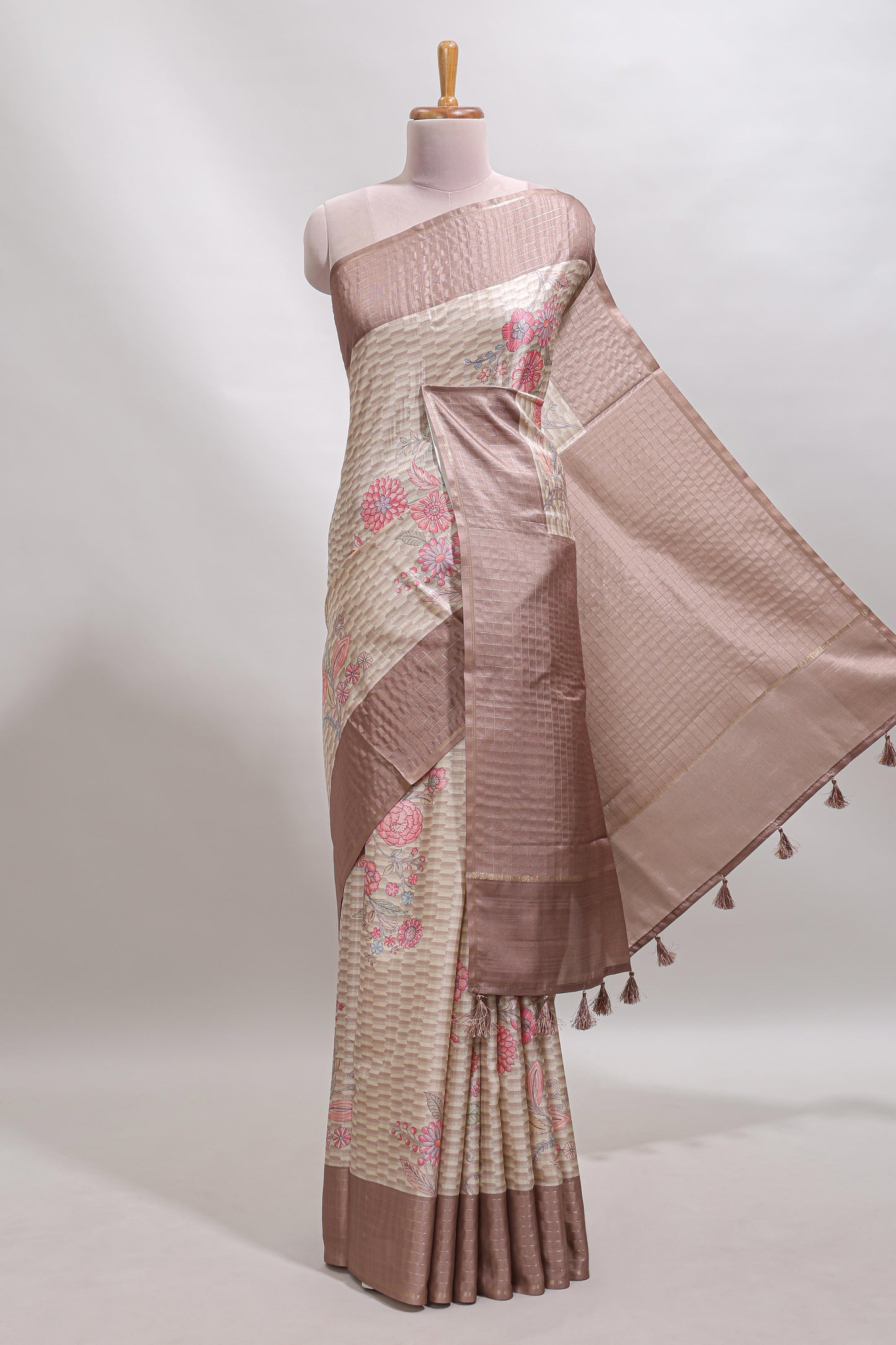 Beige geometric floral design tussar saree with contrast border and floral print blouse