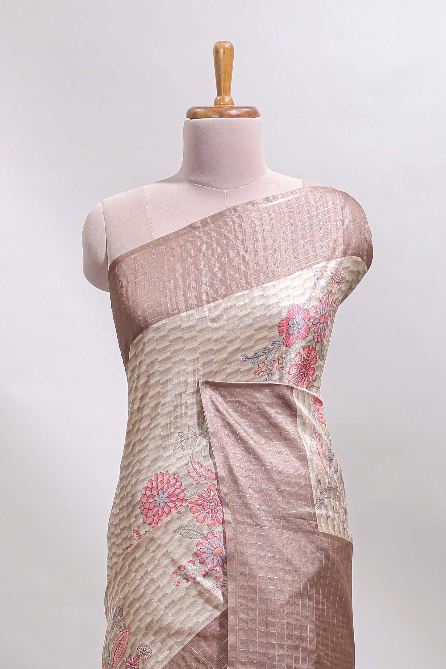 Beige geometric floral design tussar saree with contrast border and floral print blouse