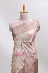 Beige geometric floral design tussar saree with contrast border and floral print blouse