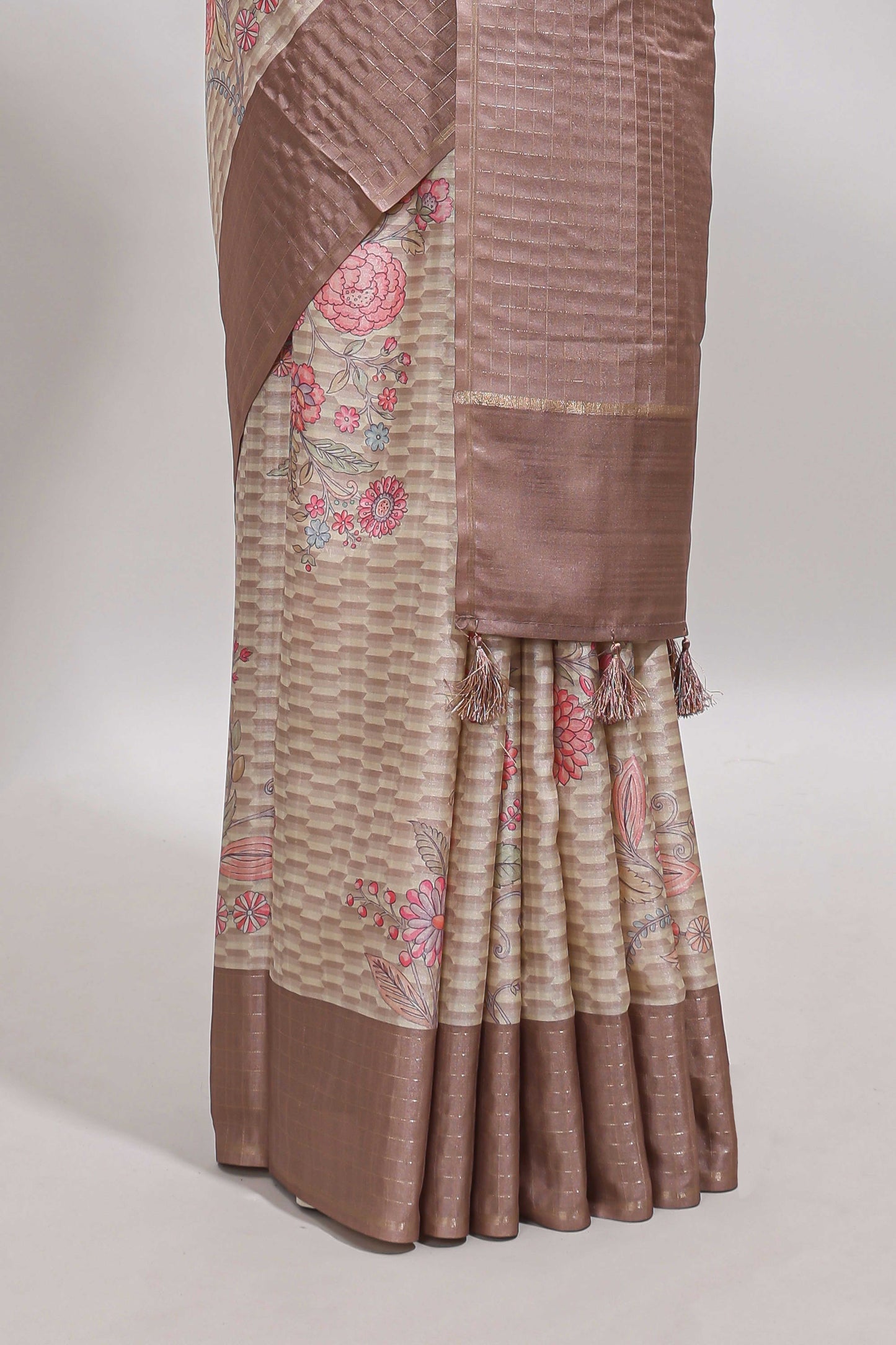 Beige geometric floral design tussar saree with contrast border and floral print blouse