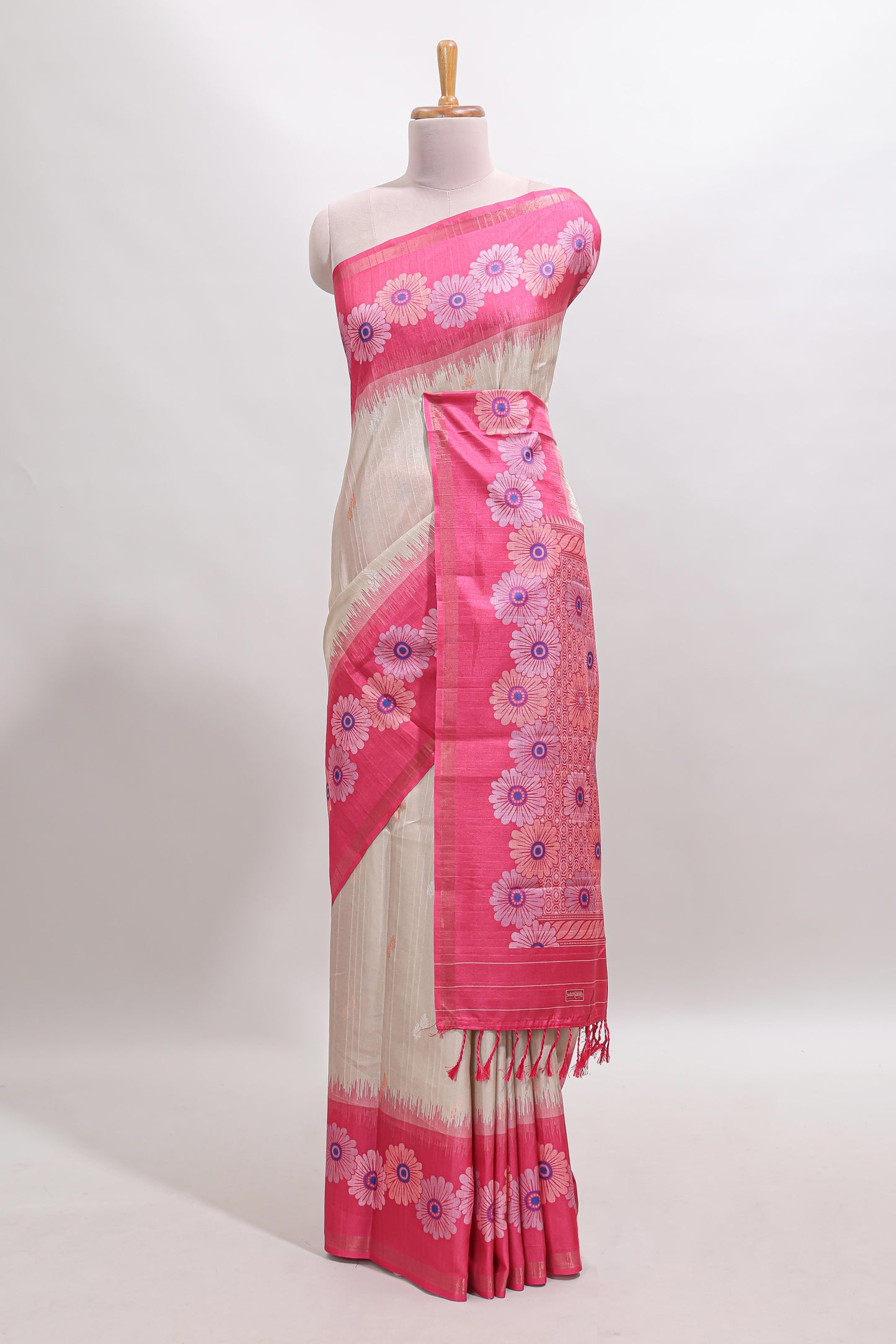 Beige striped floral motifs tussar saree with contrast floral print border and printed pallu