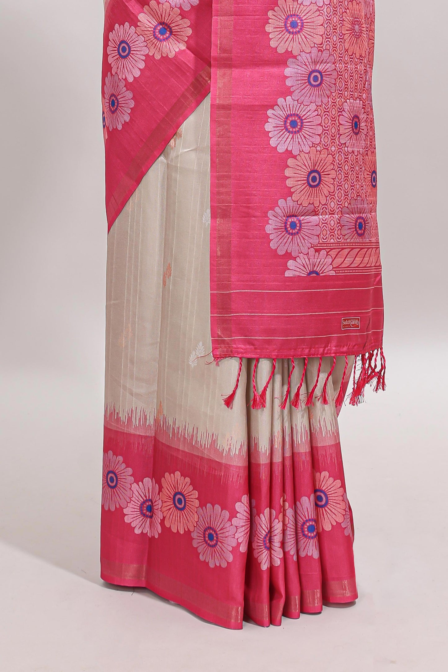 Beige striped floral motifs tussar saree with contrast floral print border and printed pallu