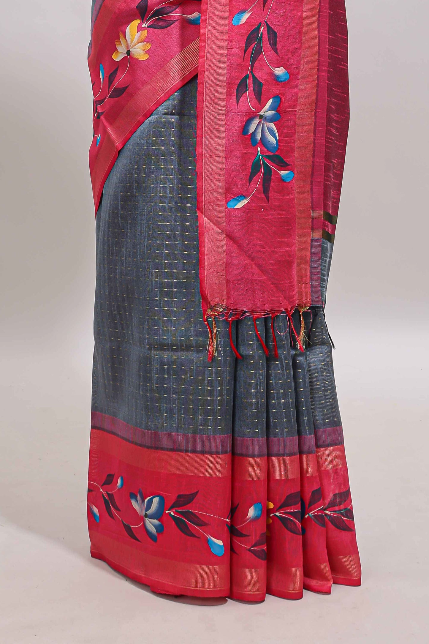 Dark grey zari design tussar saree with contrast floral print border and blouse