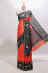 Orange zari design tussar saree with contrast floral print border and blouse