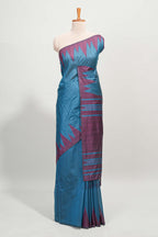 Blue plain semi tussar saree with contrast geometric border and motifs blouse