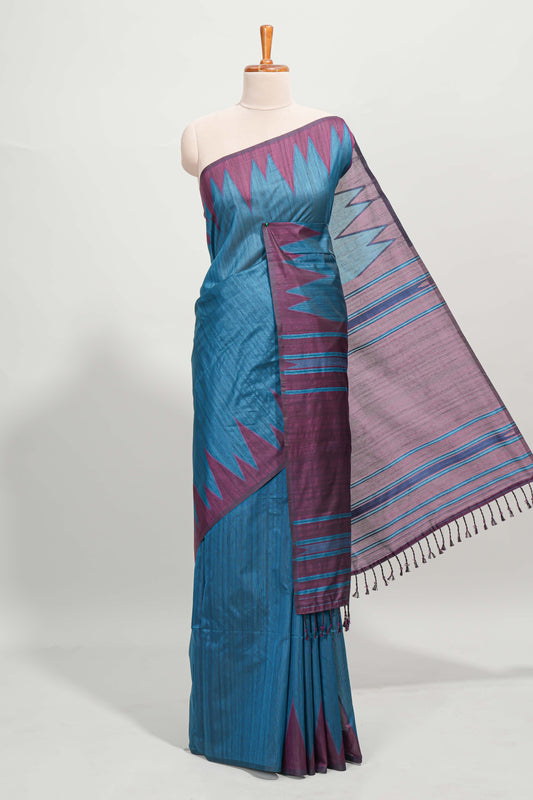 Blue plain semi tussar saree with contrast geometric border and motifs blouse