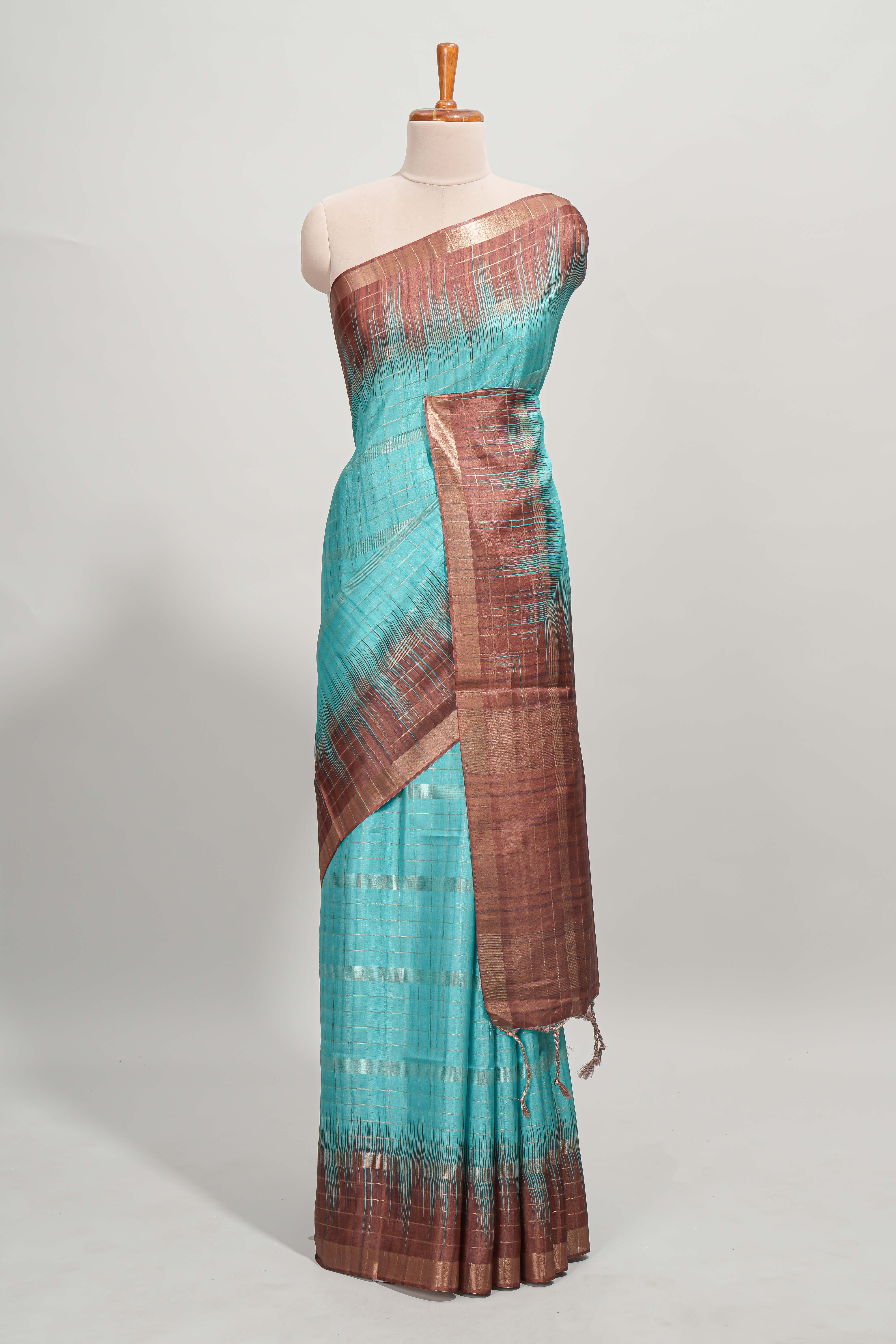 Turquoise green checked semi tussar saree with contrast border and striped blouse