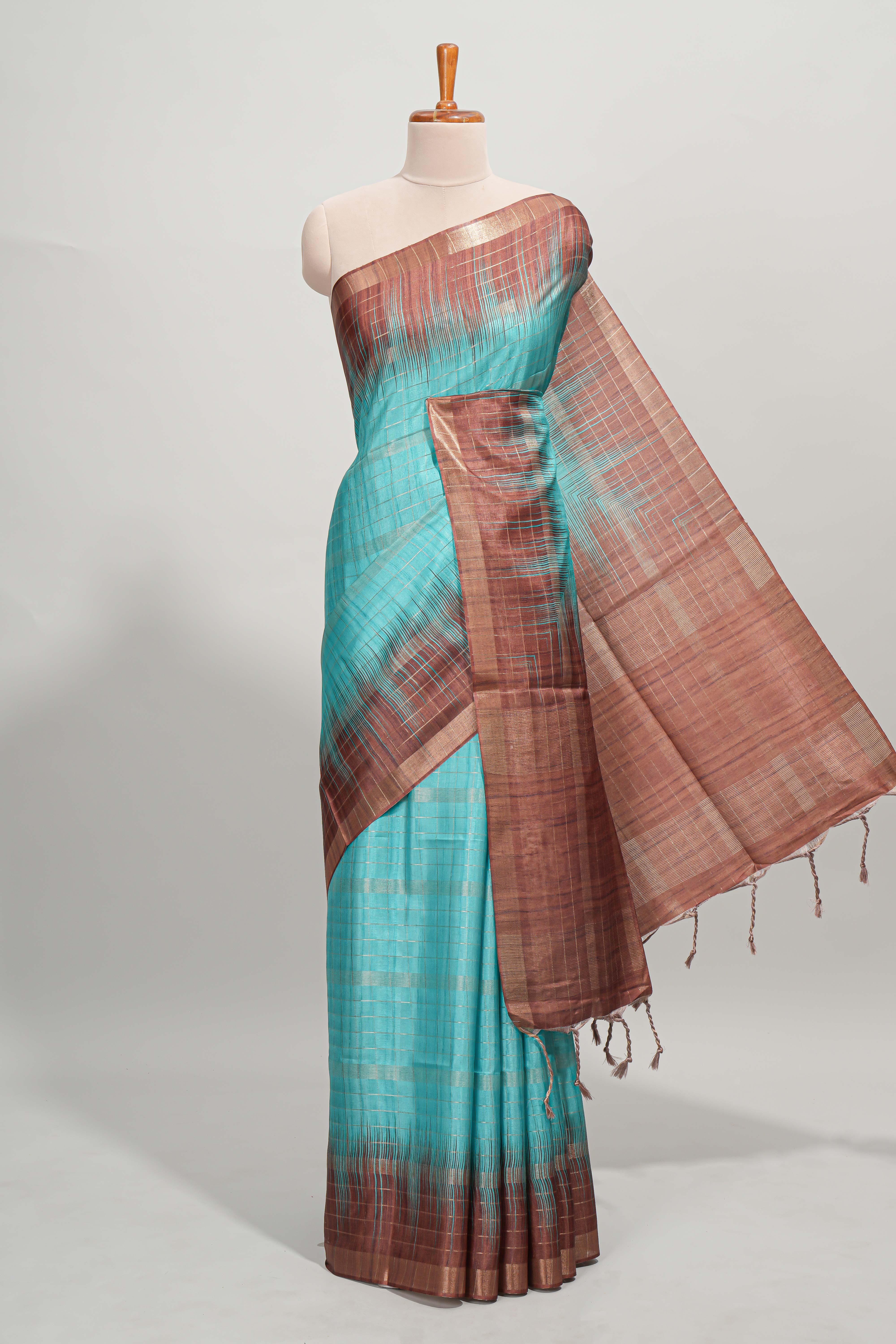 Turquoise green checked semi tussar saree with contrast border and striped blouse