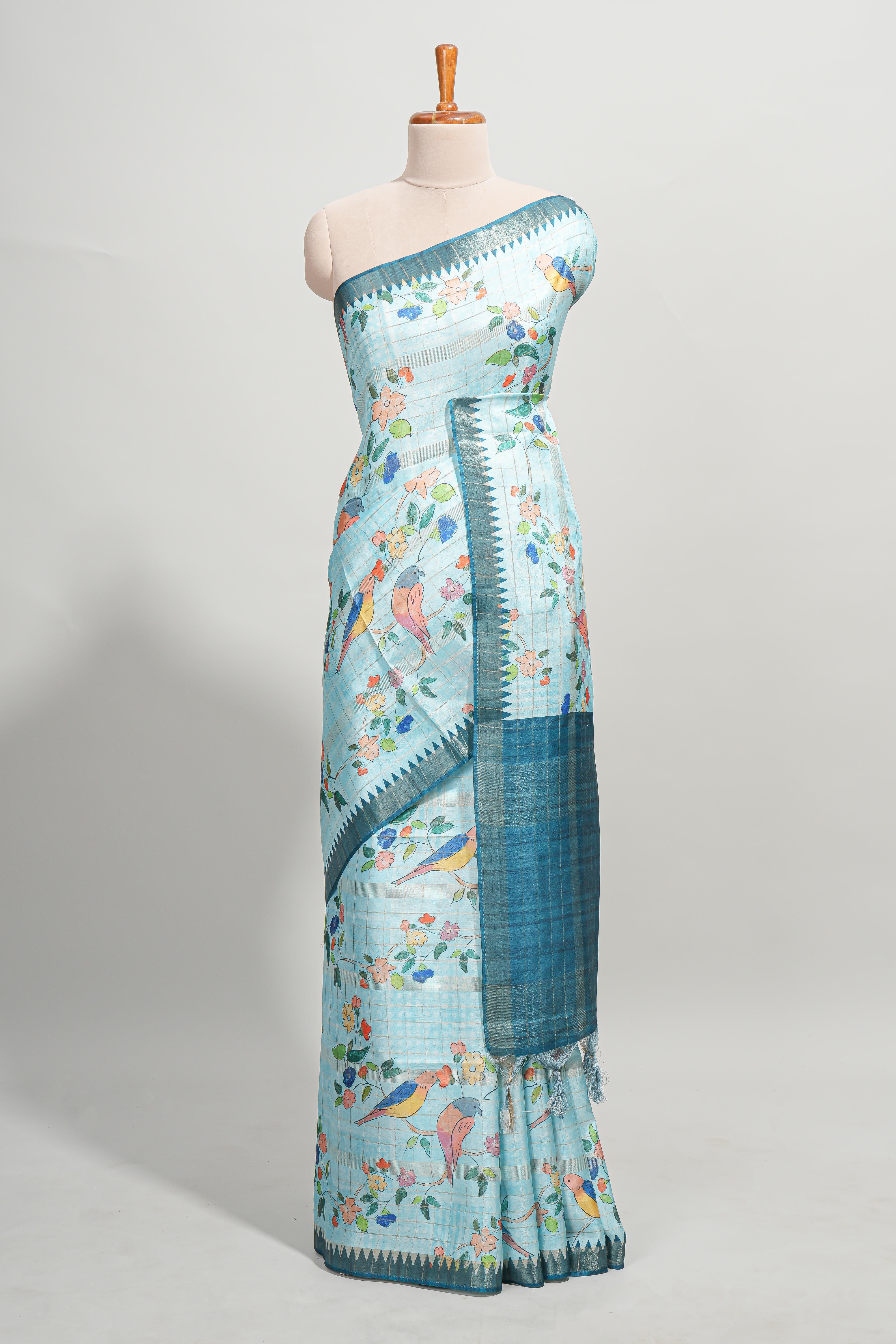 Powder blue checked birds & floral design semi tussar saree with contrast border and checked blouse