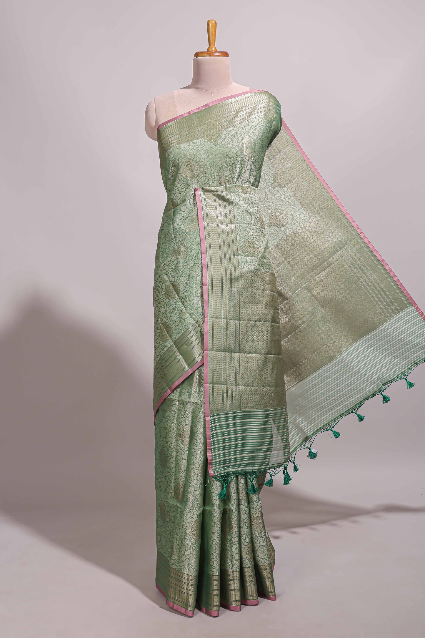Green jacquard floral zari motifs design semi tussar saree with self border and matching blouse