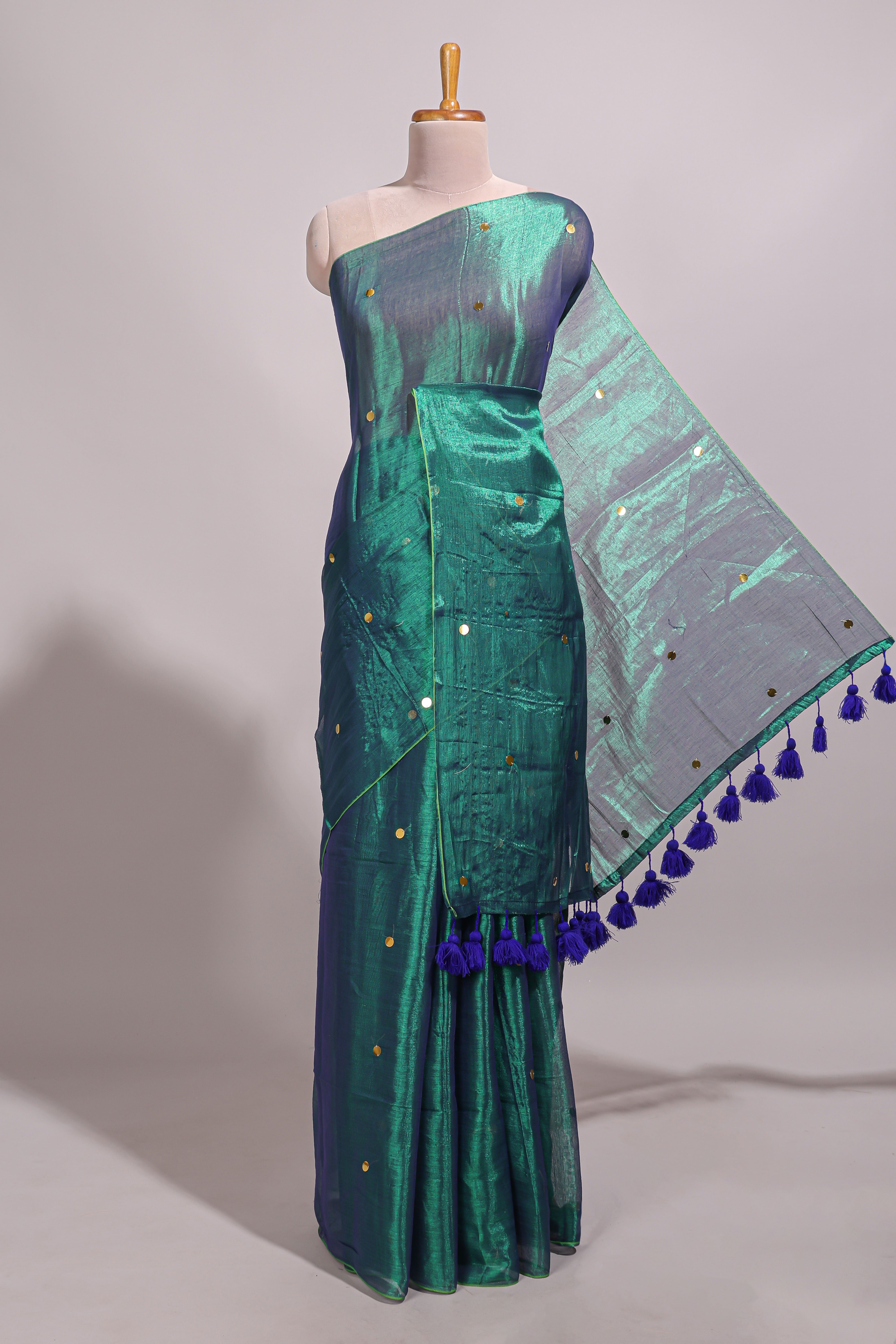 Borderless green sequins embroidery design semi tussar saree with matching blouse and contrast tassels
