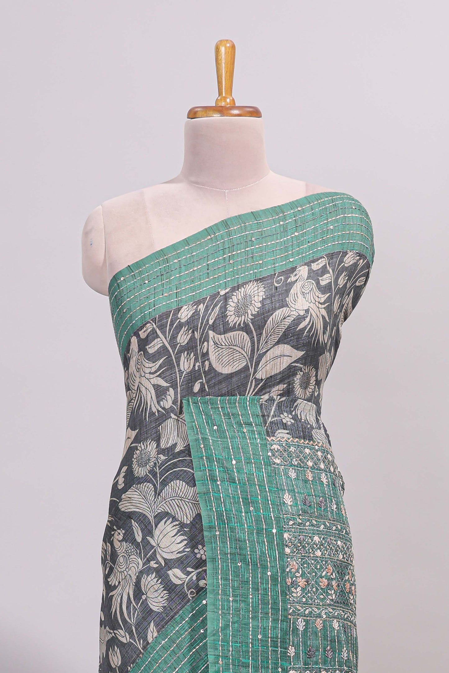 Grey floral design semi tussar saree with contrast green border and printed pallu