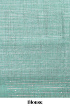 Grey floral design semi tussar saree with contrast green border and printed pallu