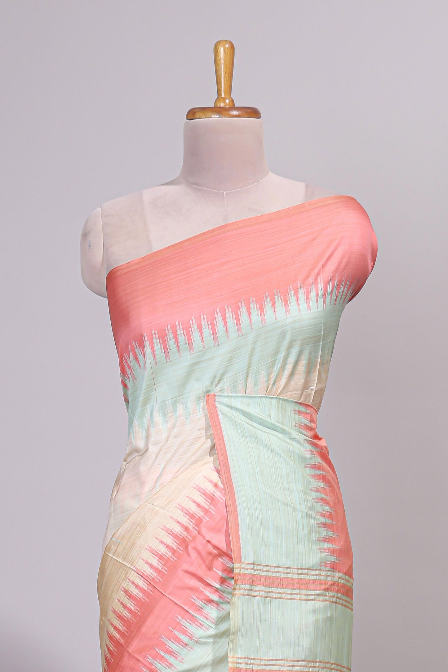 Off white ikkat design semi tussar saree with contrast dual shade border and matching striped blouse