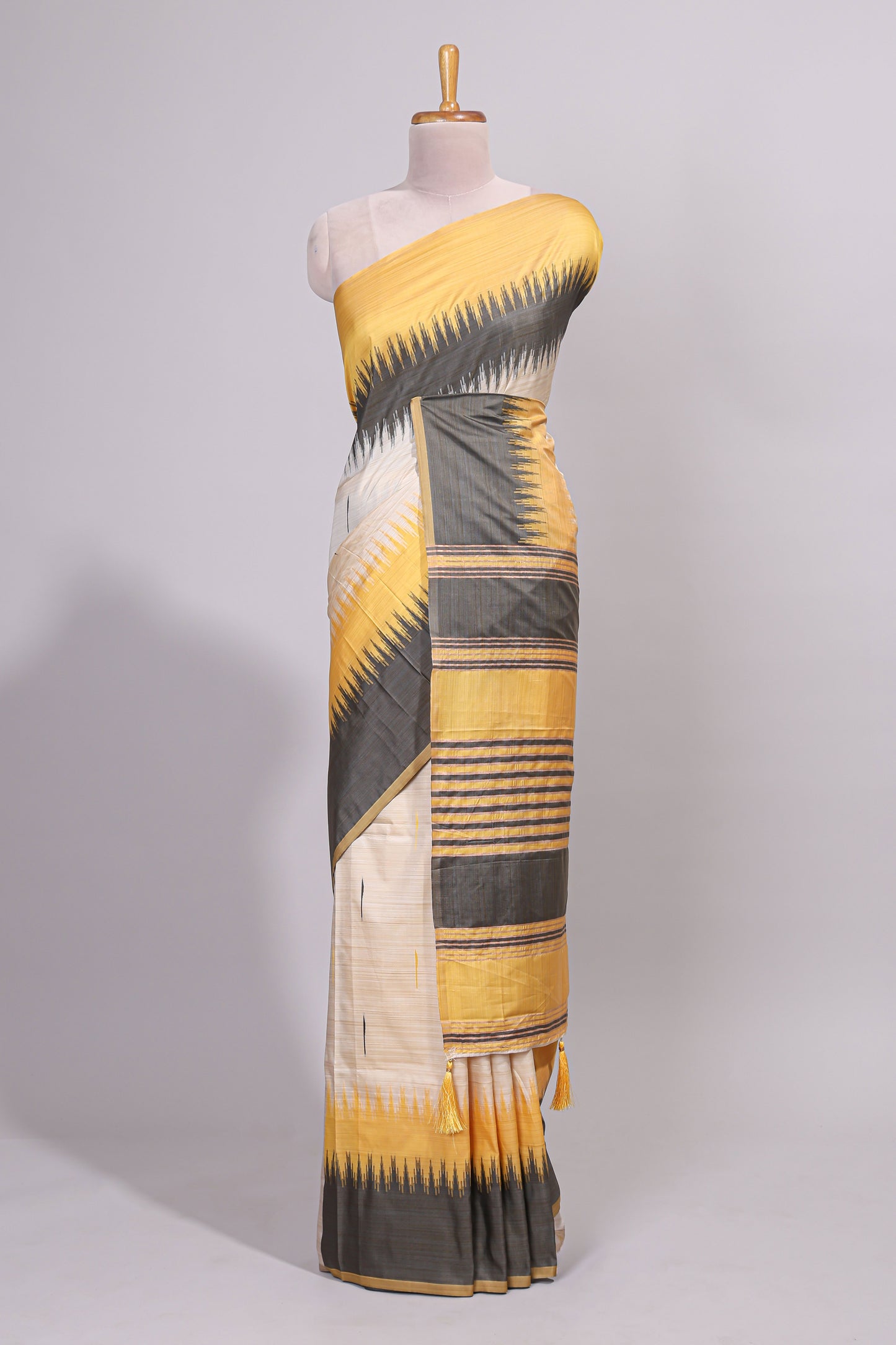 Off white ikkat design semi tussar saree with contrast dual shade border and matching striped blouse