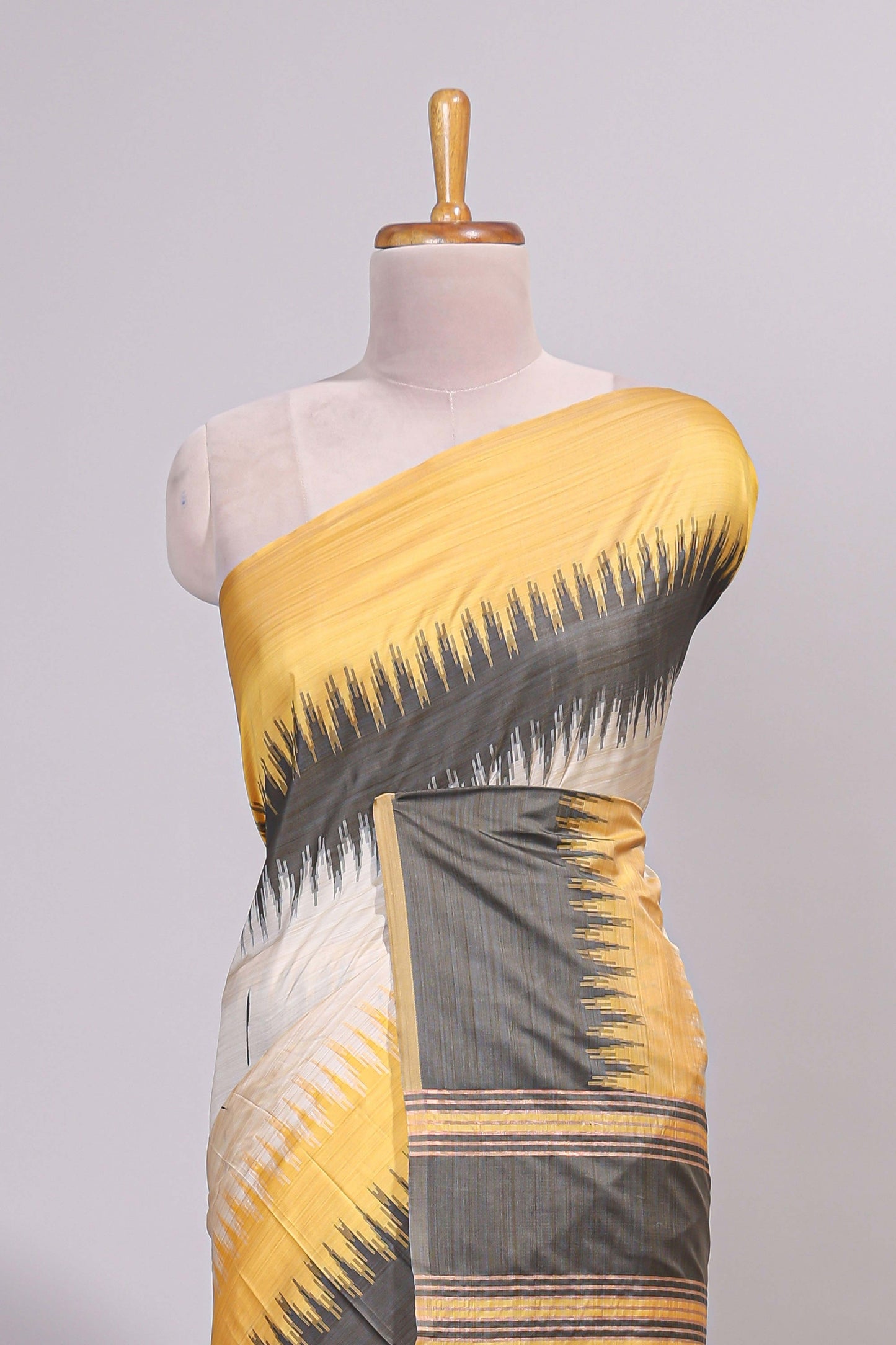 Off white ikkat design semi tussar saree with contrast dual shade border and matching striped blouse